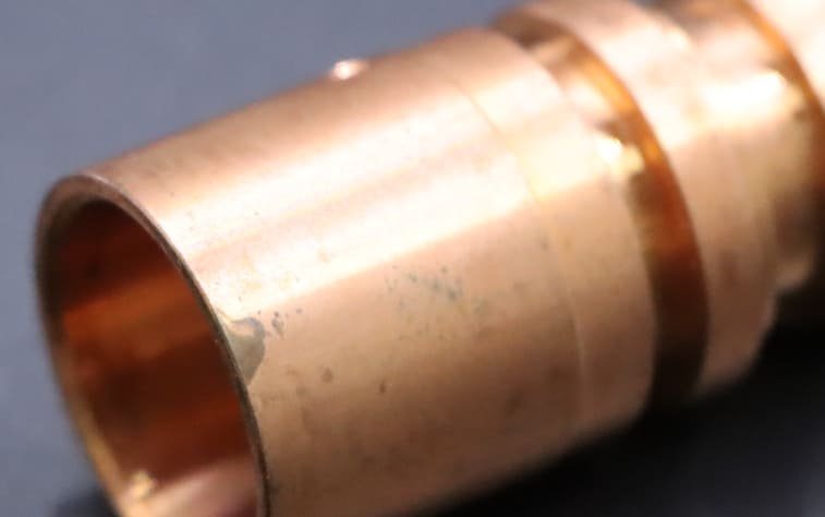 Black spots on brass parts