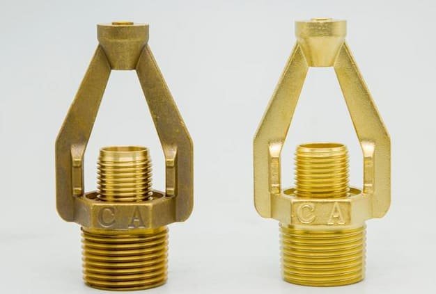 Comparison of blackened brass parts before and after treatment